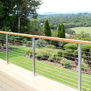 Stainless steel posts and wood top rail with cable railing infill