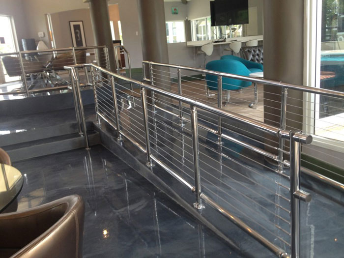 Cable railing on indoor home ramp.